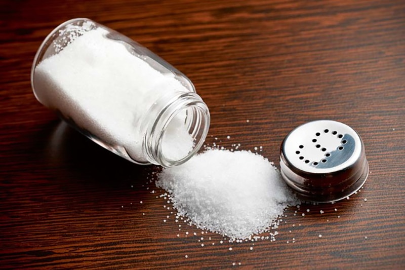 table salt full of sodium spread on the table